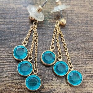 Gold tone and blue gem earrings